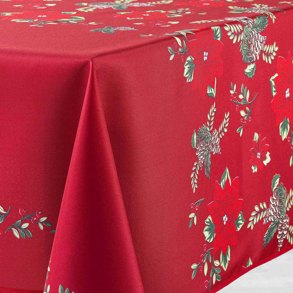 Dettaglio tovaglia antimacchia rettangolare rossa con decorazioni natalizie verdi e motivi floreali