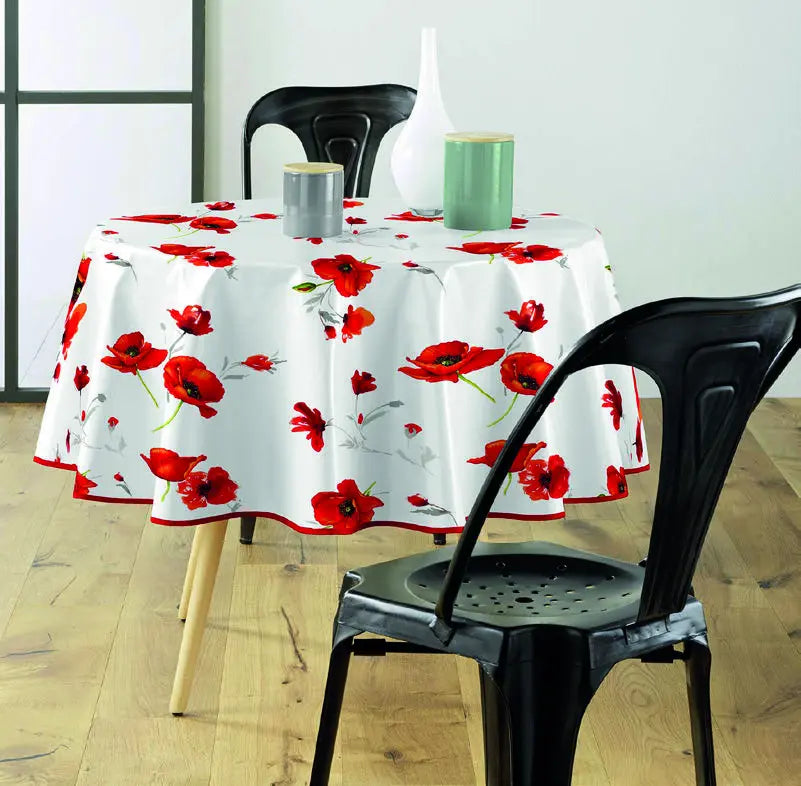 tovaglia antimacchia bianca con motivo floreale su tavolo rotondo